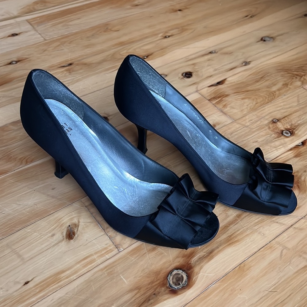 Stuart Weitzman black satin ruffle front pumps